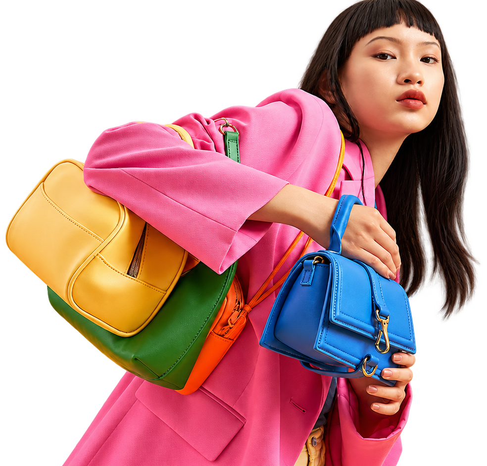 Fashion model carrying colorful handbags